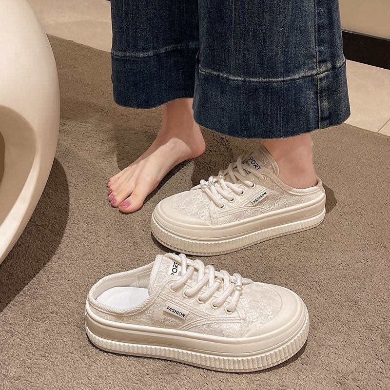 2025 verano nuevo estilo semi-trapeador zapatos blancos zapatos de mujer ropa exterior sandalias de verano Baotou estilo caliente pantuflas de malla todo-fósforo