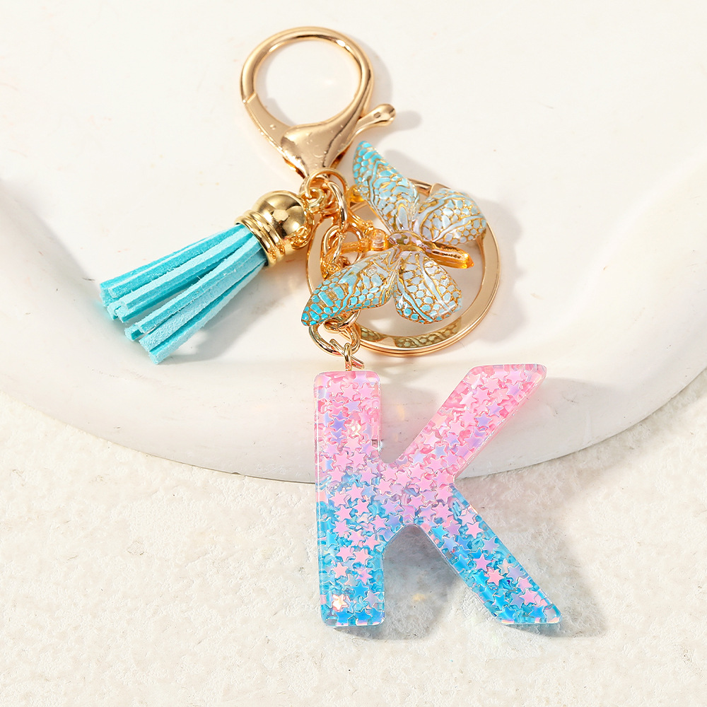 Europa y los Estados Unidos transfronterizos nuevos cristal sequinado goteo de goma letras inglesas joyería llavero y bolsos colgante apoyo al por mayor