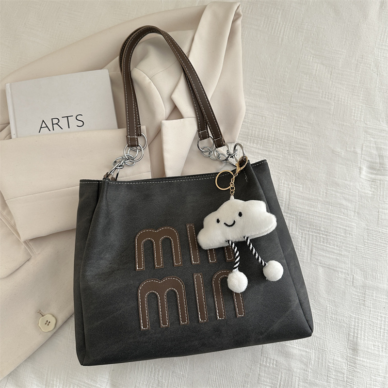 Este año, la versión coreana retro popular bolso de brazo para mujeres 2024 nueva moda bolso de mano casual personalidad textura bolso especial