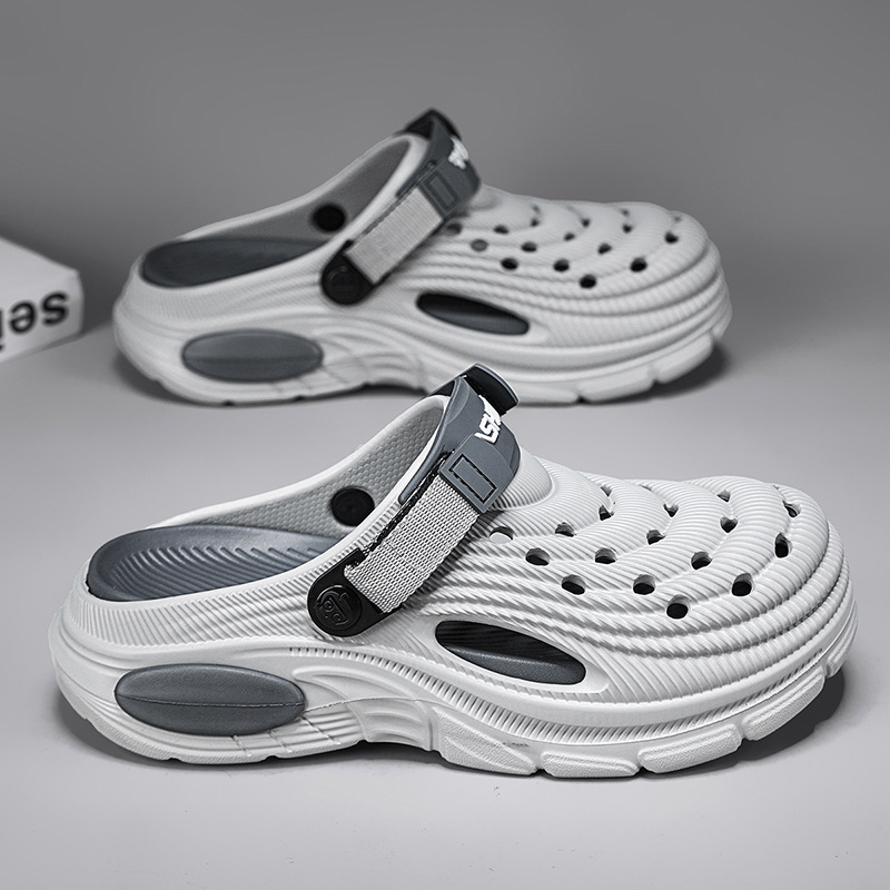 2026 nuevos zapatos de agujero para hombres y mujeres aumentan la altura de pisar la sensación de la mierda Eva dos sandalias de playa zapatillas de hombre