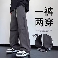 シャツの少ない服の新型のゆったりしたカジュアルなズボンの男性の韓国版のファッションのズボンの夏の薄いタイプのペンダント感の広い足のモップのズボン