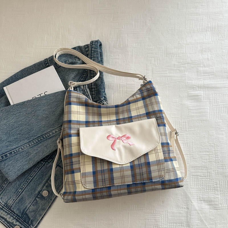 Bolsa coreana con rayas de contraste para mujeres 2024 verano nueva moda universitaria arco bolso de hombro sensación de alto nivel