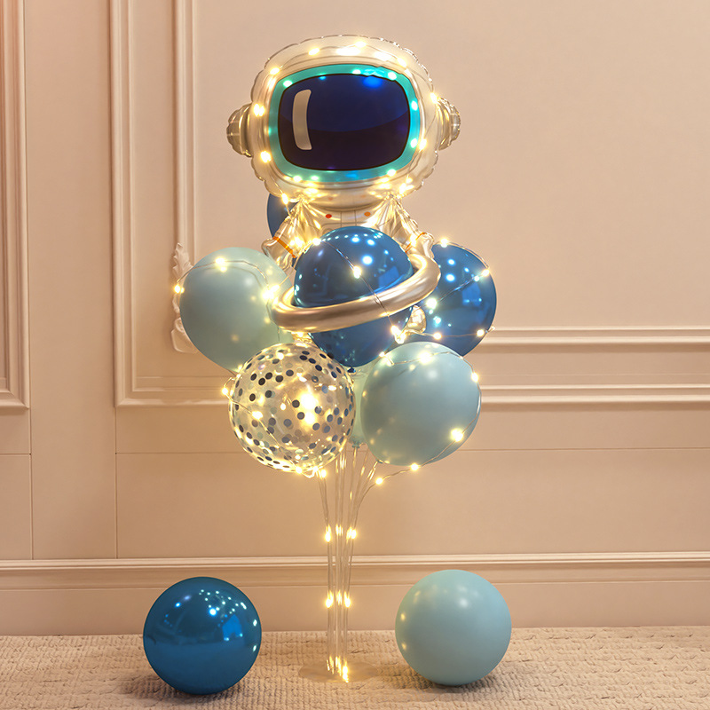 Children's little boy's birthday party decoration scene layout astronaut rocket balloon table floating lights