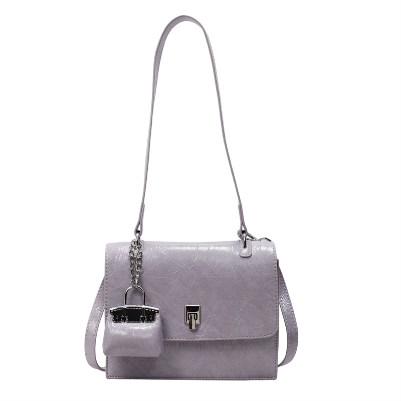 Bolso de textura transfronteriza 2025 primavera y verano nuevo bolso femenino bolso de hombro con patrón de agarre de mano de alta gama bolso de mensajero simple y versátil