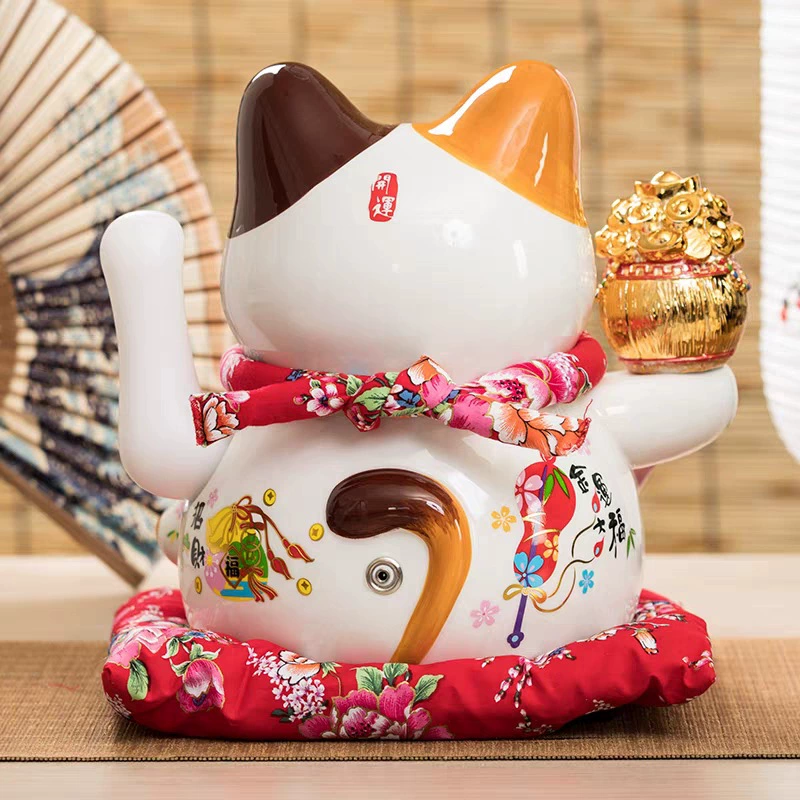 7 -inch wealth cat ornament shakes hands.