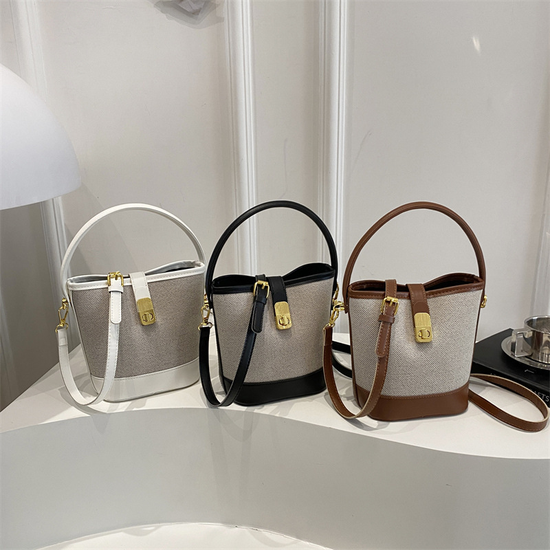 2025 This Year's Popular Splicing Lock Buckle Simple New Autumn and Winter Style Fashionable Large-Capacity Crossbody Handheld Bucket Bag 2025 This Year's Popular Splicing Lock Buckle Simple New Autumn and Winter Style Fashionable Large-Capacity Crossbody Handheld Bucket Bag