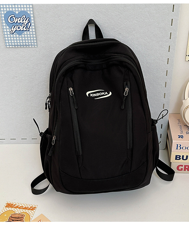 Fabricantes de mochilas escolares, estudiantes universitarias al por mayor, simples y versátiles, versión coreana de mochilas de ocio de nicho engrosadas