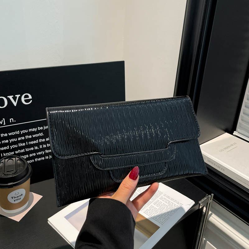Bolsa de cena de color sólido para mujeres 2026 nueva moda ocio de gran capacidad temperamento personalidad bolso de cambio bolso de mano