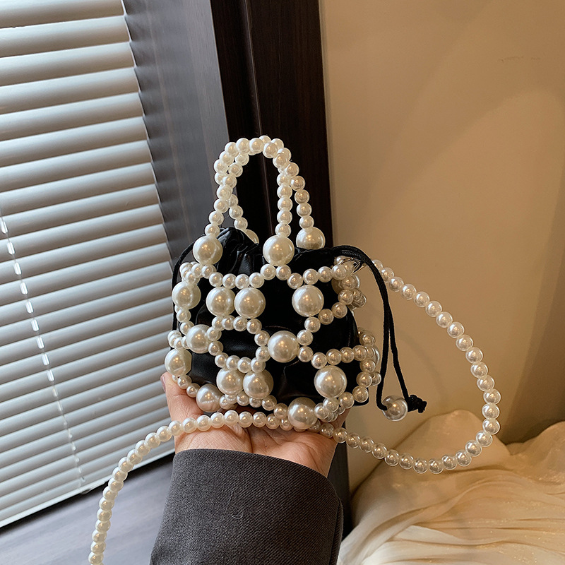 Versión coreana del nuevo estilo de verano bolso de mensajero para niños lindo perla bolso para niños y niñas mini bolso de hombro para niñas de estilo occidental