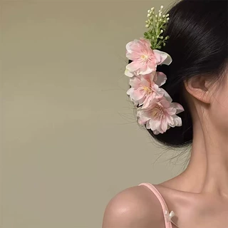 早春款粉色樱花花朵发梳氛围感盘发侧边丸子头簪花度假风温婉头花