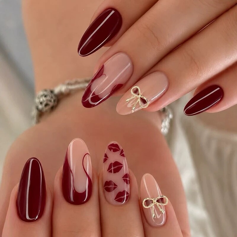 Valentine's Day Fashionable False Nails in Wine Red with Lip Print, Almond Shape, Heart-Shaped Bow, and Metallic Rhinestone Decorations Valentine's Day Fashionable False Nails in Wine Red with Lip Print, Almond Shape, Heart-Shaped Bow, and Metallic Rhinestone Decorations