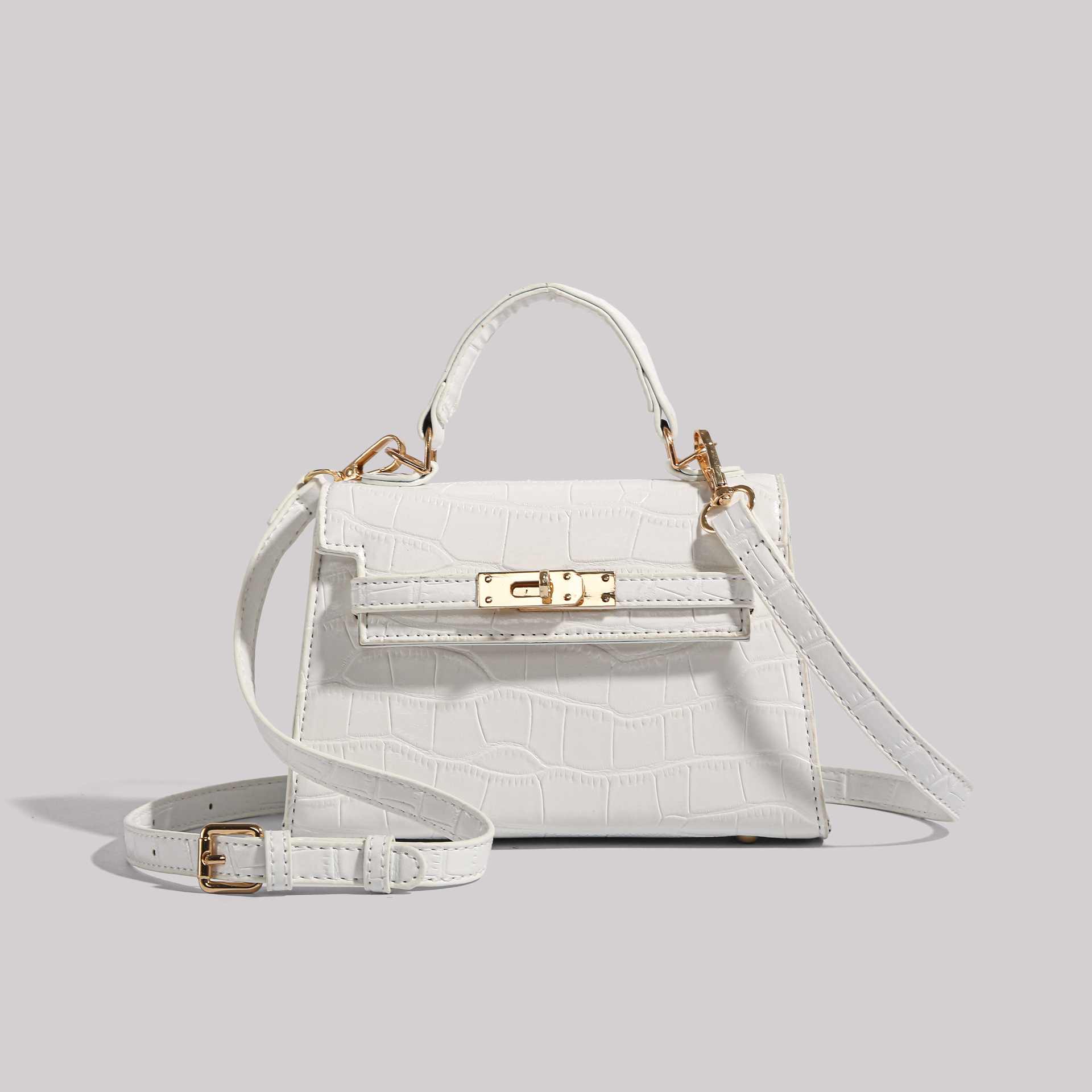 Los fabricantes venden directamente el nuevo bolso Kelly simple en 2025 con un bolso cuadrado pequeño y un bolso con patrón de cocodrilo.