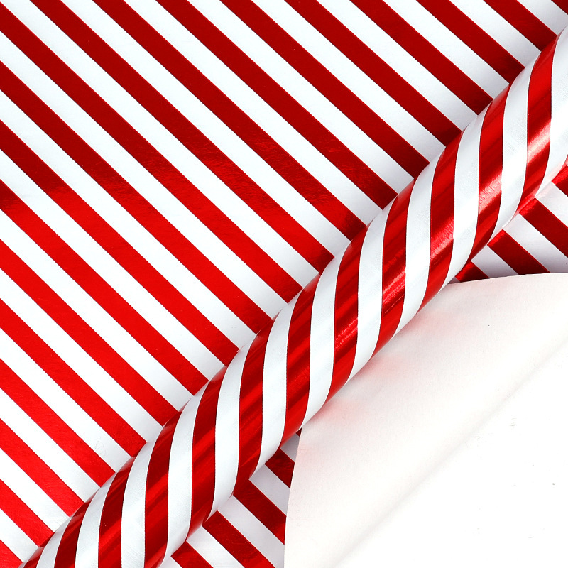 Papel de regalo navideño clásico y popular de gran tamaño con diseño de dibujos animados y temática navideña para envolver regalos.