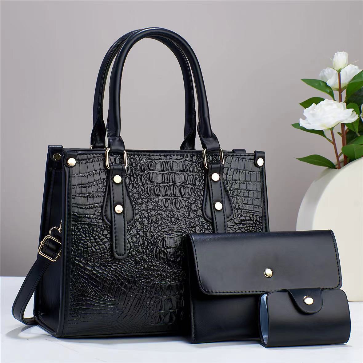Bolso de mujer de moda popular 2026 nuevo transfronterizo de tres piezas europeas y estadounidenses paquete de bolso de madre para mujeres de viaje universal mochila de hombro