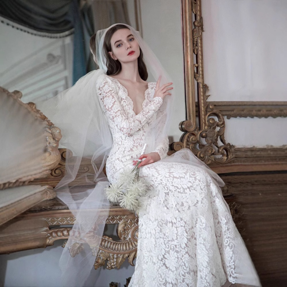 El comercio exterior de encaje francés de cola de pescado ligero vestido de boda 2024 nuevo vestido de novia de encaje de manga larga vestido de alta calidad