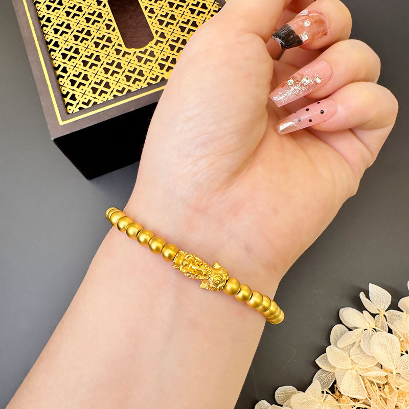 Fábrica directa de oro de arena de arroz de cuentas de pulsera de estilo chino herencia de la antigua ley de la marea nacional auspiciosa joyería de cobre chapado en oro al por mayor