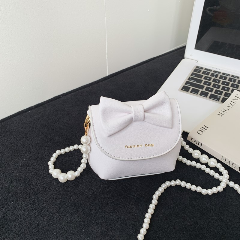 Cute mini niñas bolso de hombro dulce perla bolso de bebé coreano nuevo bolso de cambio de color sólido para niños