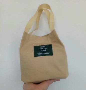 Bolso de mujer nuevo estilo coreano simple bolso de lienzo de chicas fresco de color sólido bolso de cubo de moda moda bolsa de mochila casual