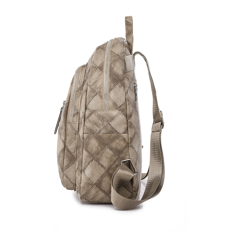 Spot al por mayor 2023 nueva mochila de cuero suave para mujer retro casual moda rombo urbano simple mochila marea