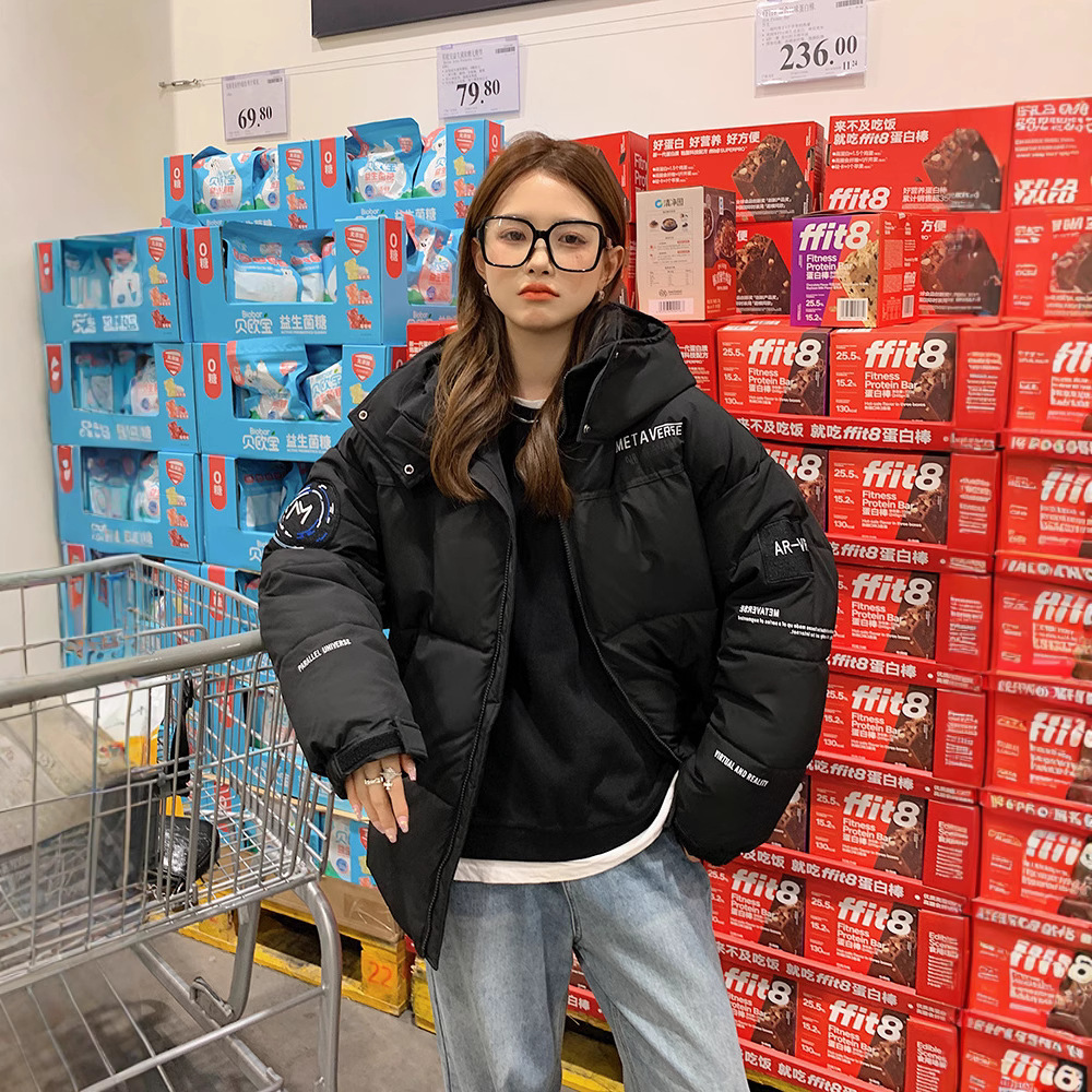 Comercio exterior invierno de 2025 nueva ropa de algodón de color grueso con sombrero de mujer ropa de algodón suelta ropa de pan chaqueta de algodón