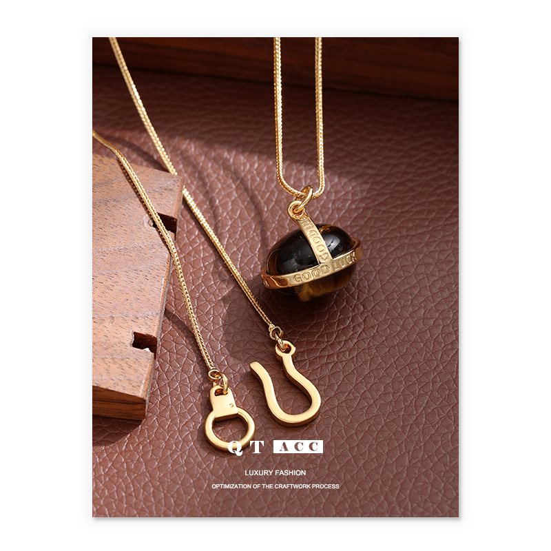 Transición fronteriza de moda europea y americana Mirad retro collar de piedra de ojo de tigre simple ligero lujo de alto nivel cadena de suéter largo otoño invierno