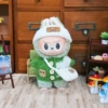 Green sweater, white hat, bag