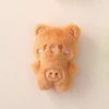 Коричневый медвежонок с улыбающимся лицом