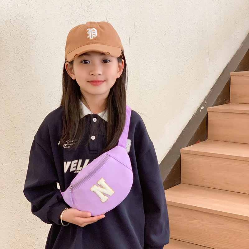 Bolsas coreanas para niños y niñas, bolsas de pecho de color sólido para bebés, 2026 nuevas bolsas de niños transfronterizas
