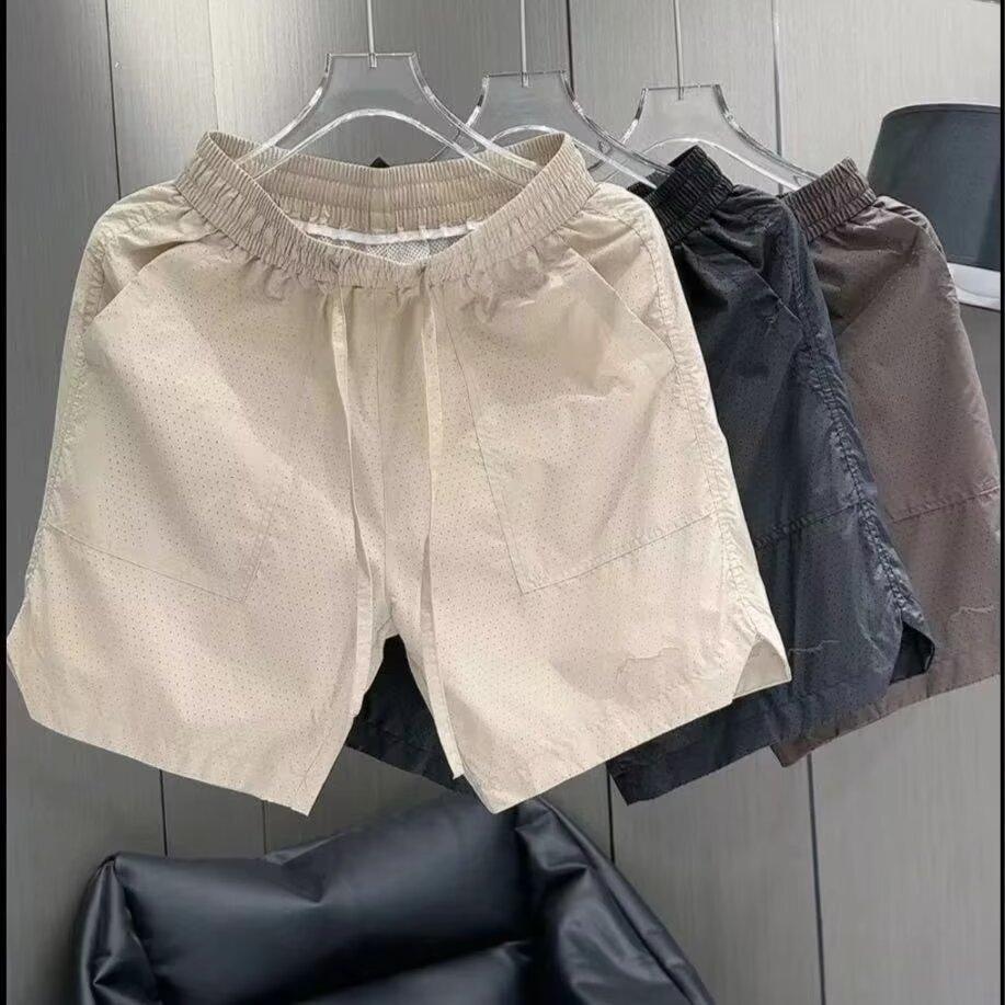 Pantalones cortos de malla transfronterizos estadounidenses de estilo de moda masculino delgados de diseño de nicho sueltos grandes pantalones deportivos casuales de cinco puntos