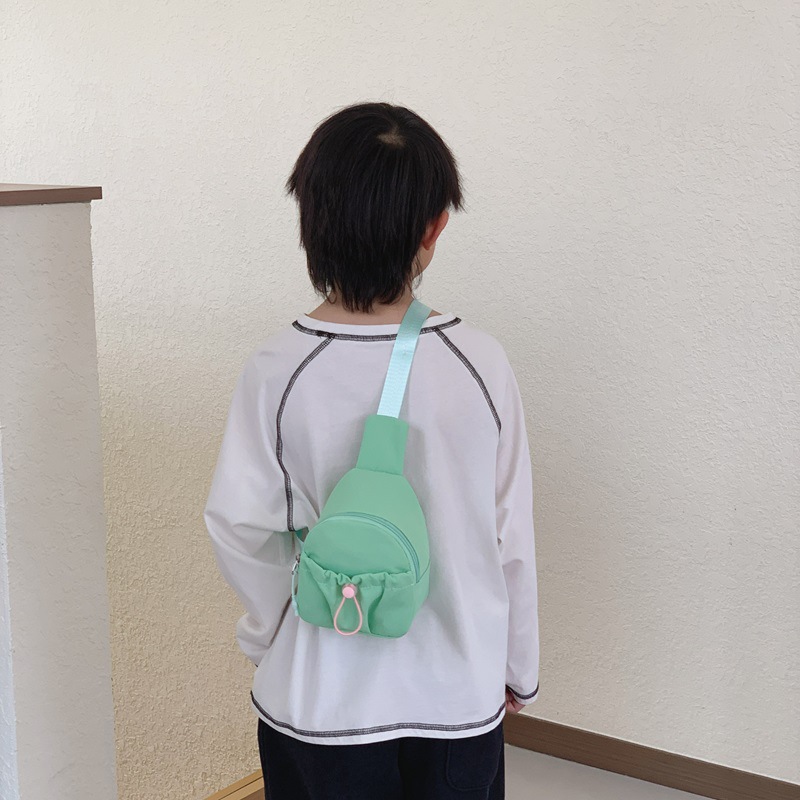 Bolso de pecho simple de color sólido para niños y niñas, bolso de ocio, bolso de mochila infantil ligero, 2026 nuevo bolso de cambio para niños
