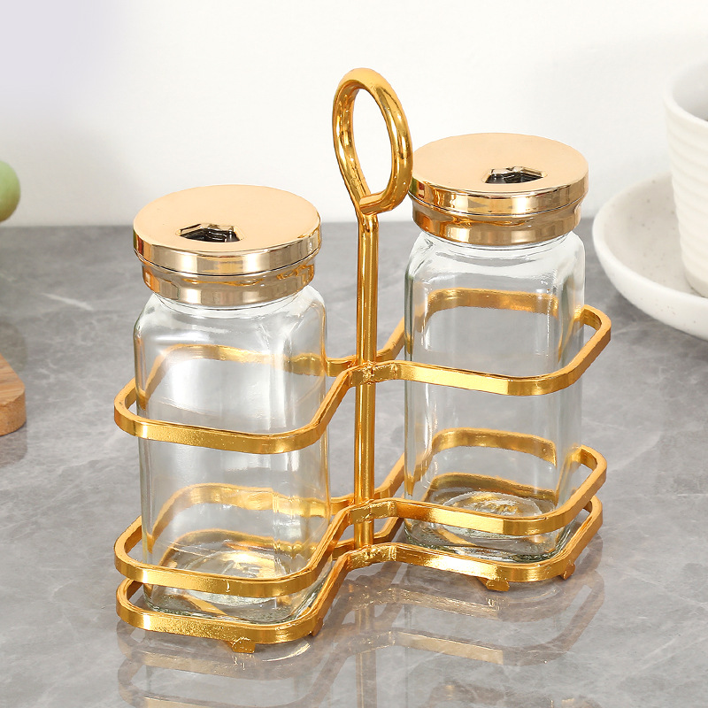 Tarro de condimento de vidrio transparente al por mayor, suministros de cocina, tarro de condimento de sal MSG, juego de botella de condimento creativo de lujo ligero para el hogar