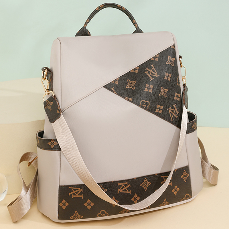 Comercio exterior al por mayor 2024 nueva mochila antirrobo de nailon para mujer retro, mochila multifuncional de doble uso de color de contraste de moda