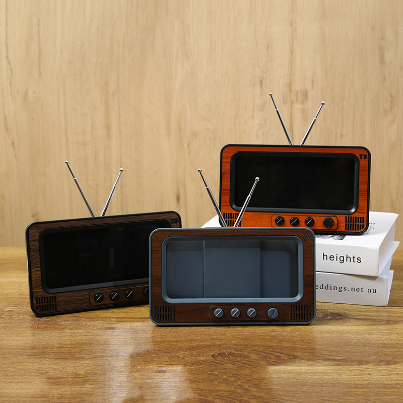 創意的なレトロなデスクトップの携帯電話のスクリーンのアンプは劇のテレビの形を追ってbluetoothの音響の携帯電話のスタンドを持ちます。|undefined