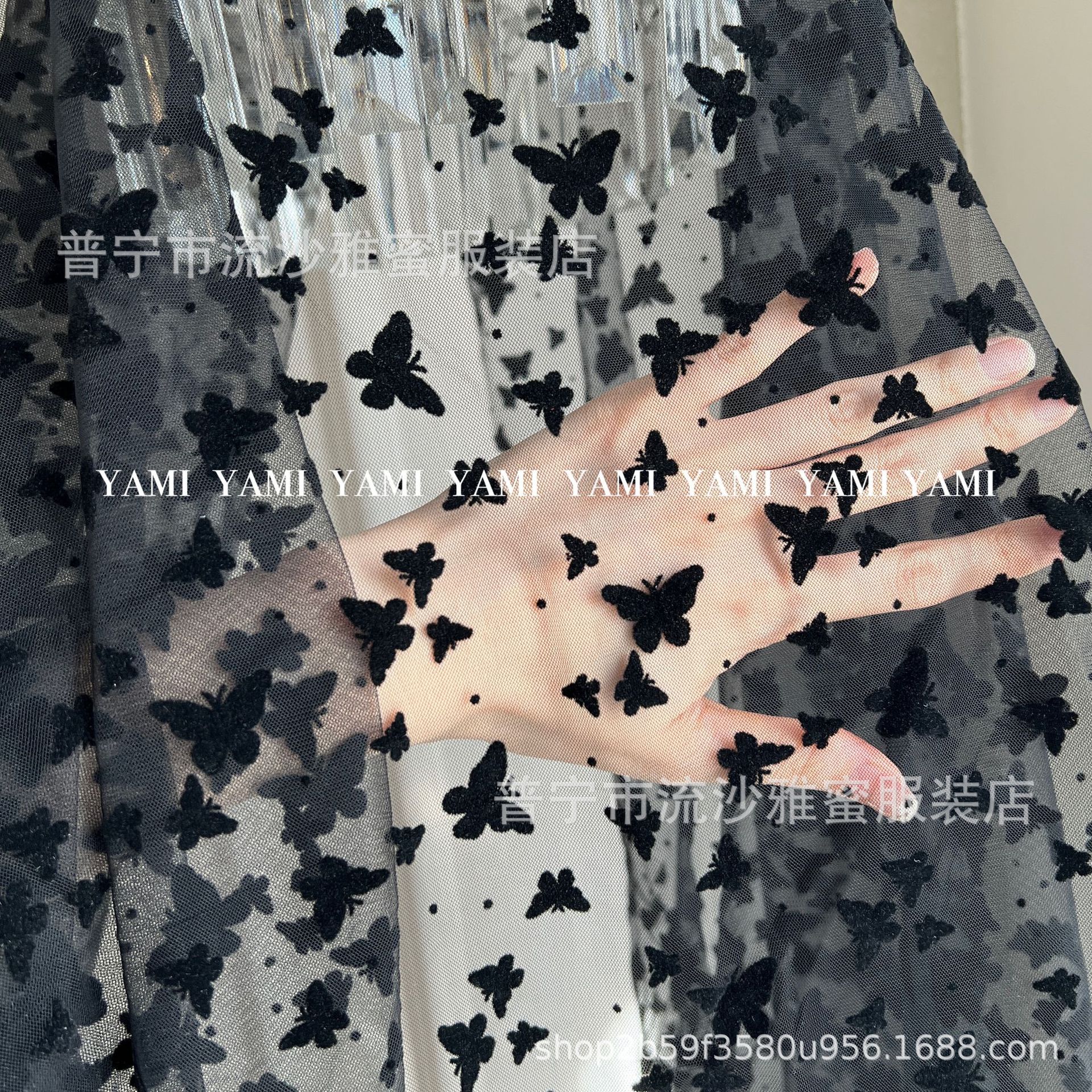 Fábrica al por mayor de tela de malla flocado tamaño mariposa punto hilo de malla ropa infantil Lolita tela de velo vestido chino material de ropa