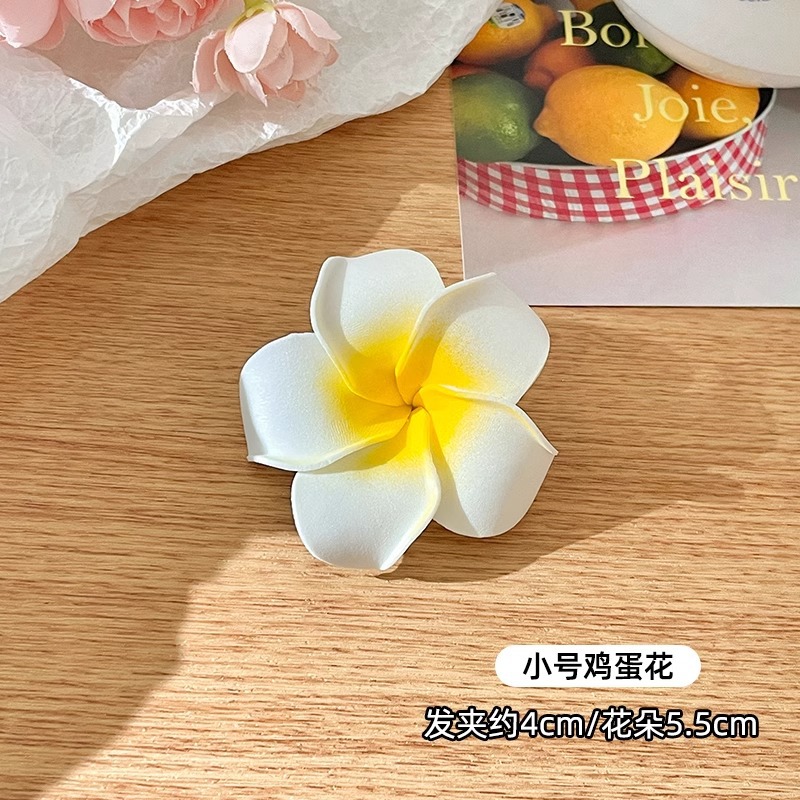 Huevo flor clip lateral clip lateral de alta calidad mujer 2025 nuevo tocado de cabello de flores de playa clip de flores de tamaño grande