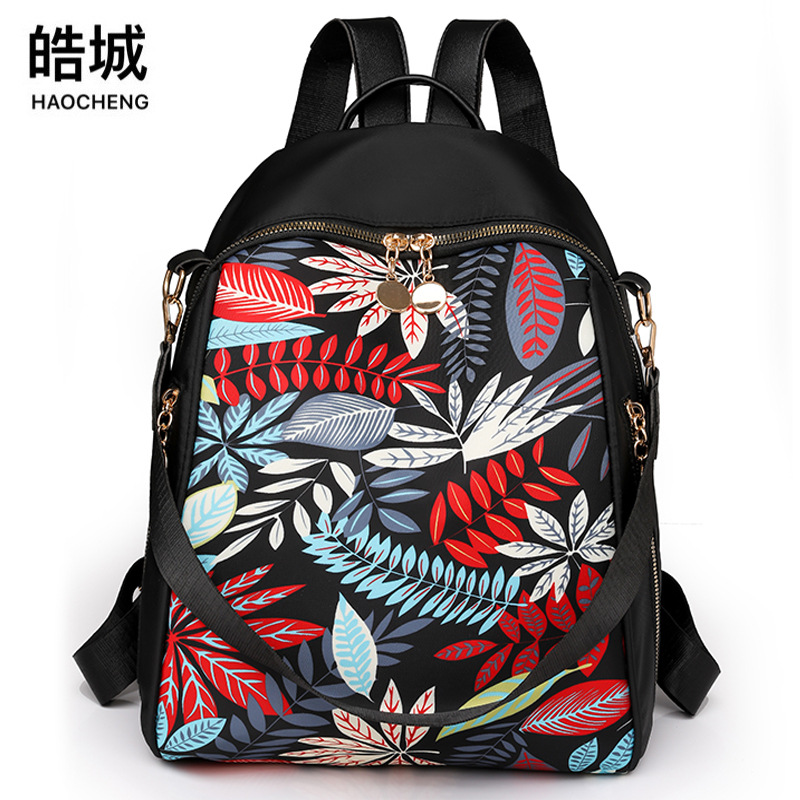 Bolsos para mujer 2023 nueva mochila de nylon para mujer coreana moda salvaje color de contraste mochila de viaje al aire libre al por mayor