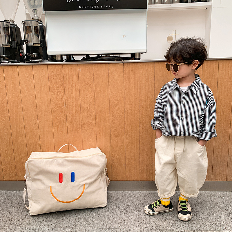Bolsa Infantil Otoño/Invierno 2025, Nueva Bolsa con Cara Sonriente, Bolsa de Hombro de Lona de Gran Capacidad, Bolsa de Almacenamiento de Edredones Portátil para Jardín de Niños