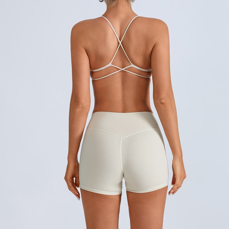 Traje de yoga europeo y americano transfronterizo, espalda hermosa con almohadilla para el pecho, sujetador con tirantes cruzados, pantalones deportivos de secado rápido de melocotón de cintura alta