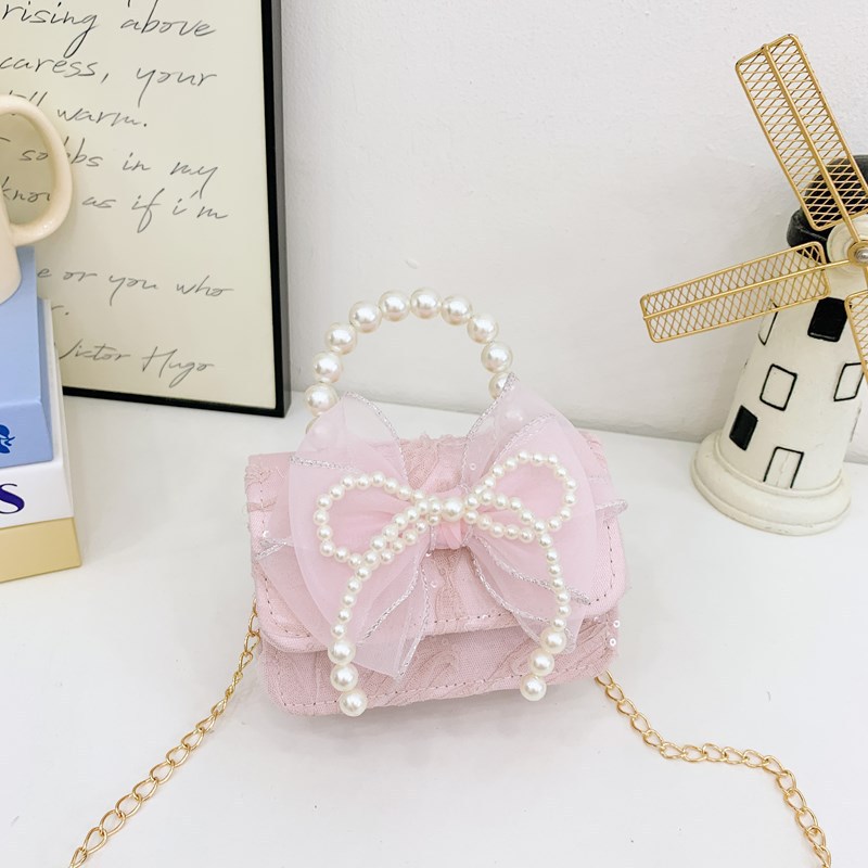 Nueva princesa flor de encaje niñas mochila de hombro de moda perla arco bolso de niños bolso de cambio de dibujos animados