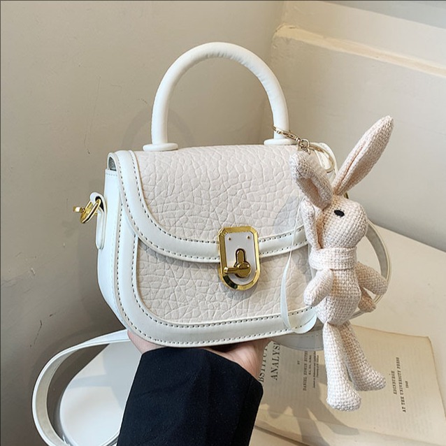 Sensación de alta gama patrón de piedra moda moda portátil pequeño bolso cuadrado femenino 2025 nuevo bolso de mensajero de hombro casual simple y versátil