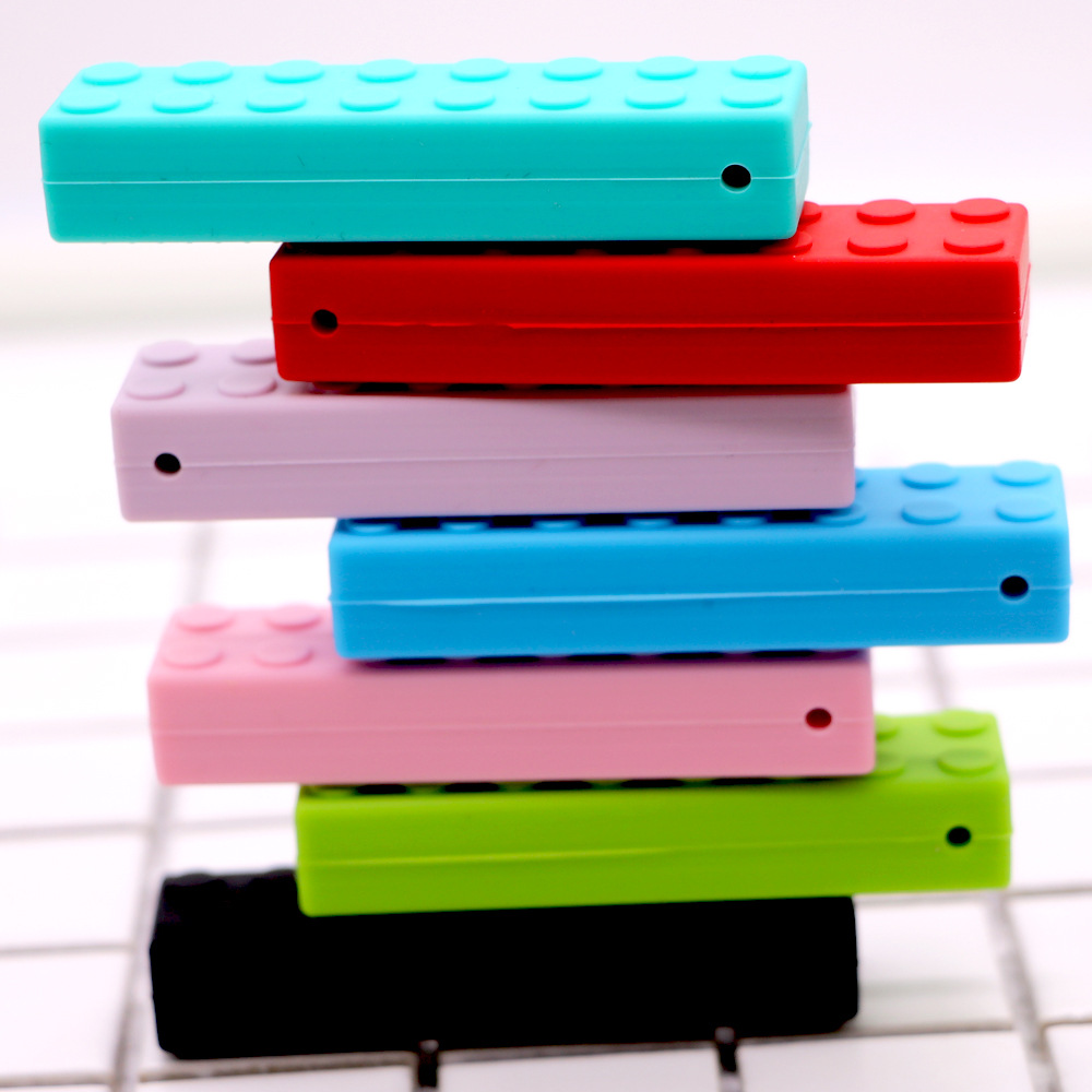 Bloques de construcción de silicona fabricantes de mordedor niños bloques de construcción de ladrillo de silicona teether sensorial masticar colgante bebé teether stick