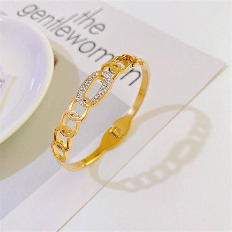 Fashionable New Plated 18k Gold Hollow Inlaid Zircon Titanium Steel Bracelet display picture 1