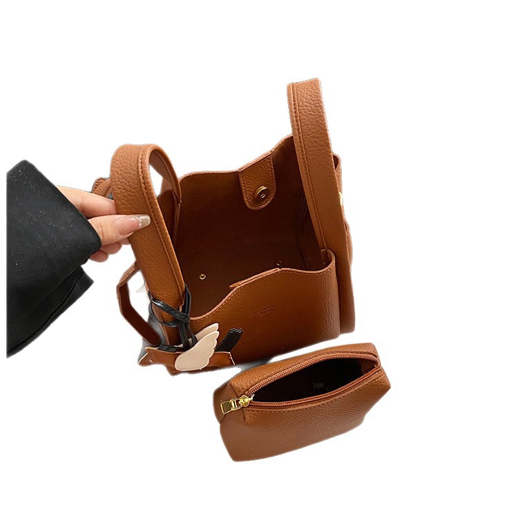 Bagos de cubo de nicho de alta calidad bolsos de mano para mujeres otoño 2025 nuevo paquete de cestas de hombro para niños bolsos de mano