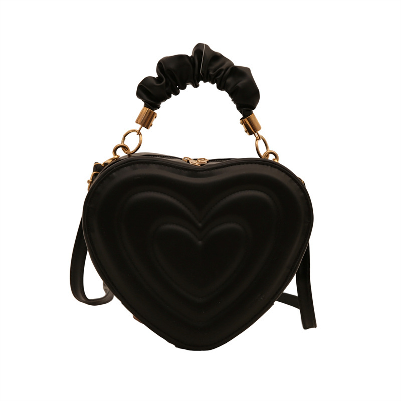 2024 otoño y invierno de mujeres nuevas caramelo de cáscara dura bolso de hombro de color corazón bolso de moda bolso de amor amor amor impresión