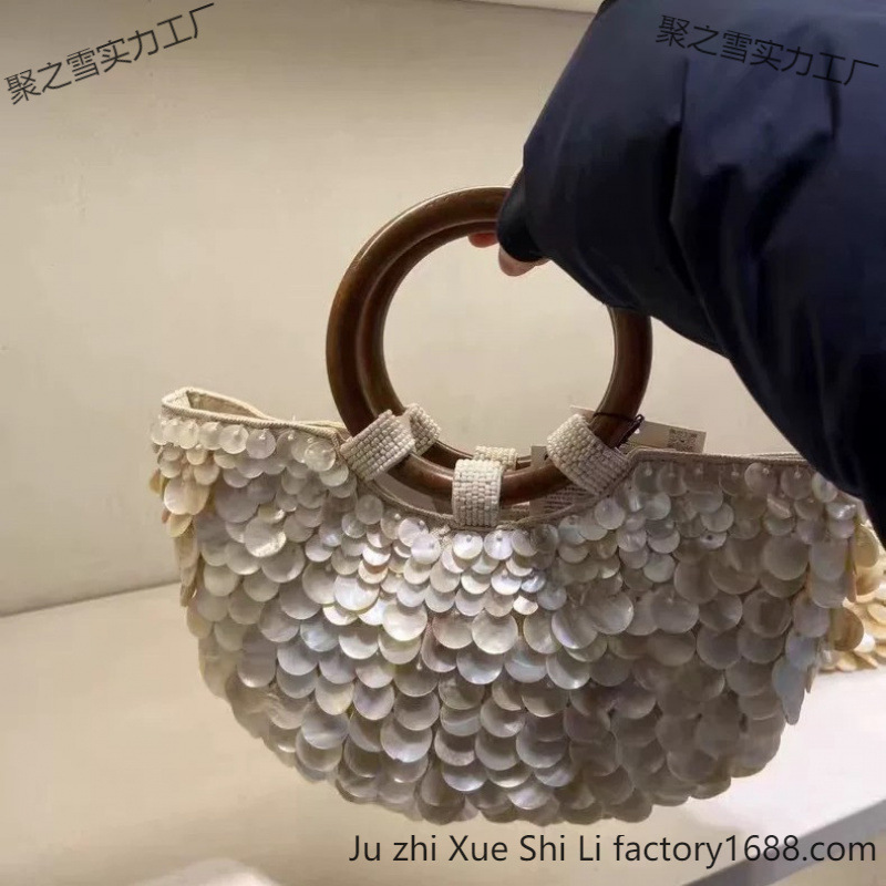 2025 primavera y verano nuevo estilo de alta sensación pura mano natural conchas bolsas de hadas bolsas portátiles bolsas de mujer pequeñas tendencia de personalidad crowdsourcing