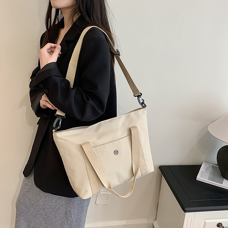Primavera nueva bolsa de viaje impermeable de gran capacidad de alto valor, bolsa diagonal de un solo hombro para mamá de compras portátil de moda