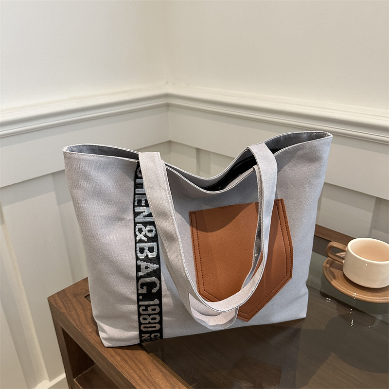 Bolso de mujer 2024 invierno nuevo bolso de gran capacidad de transporte de lona bolso de brazo de moda simple bolso de hombro