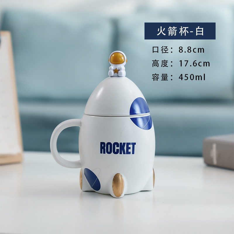 Taza de cerámica de cohete de dibujos animados Taza creativa con cuchara de tapa Taza de café de leche de dibujos animados lindo ins de alto valor