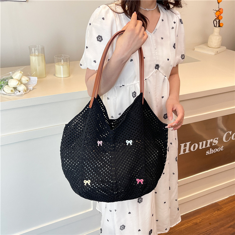 Viaje junto al mar estilo vacaciones bolso de playa tejido hueco mujer 2025 verano nuevo bolso tejido de paja bolso de alta capacidad
