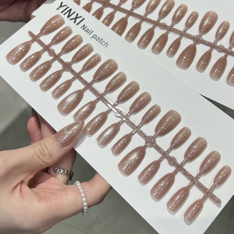 Pink-toned rose gold glass bead cat-eye press-on nails in almond shape, Korean style, gentle and elegant, with shimmering effect